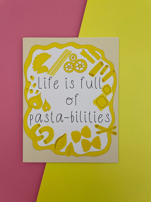 Card with pasta illustrations and text 'Life is full of pasta-bilities' on a yellow and pink background.