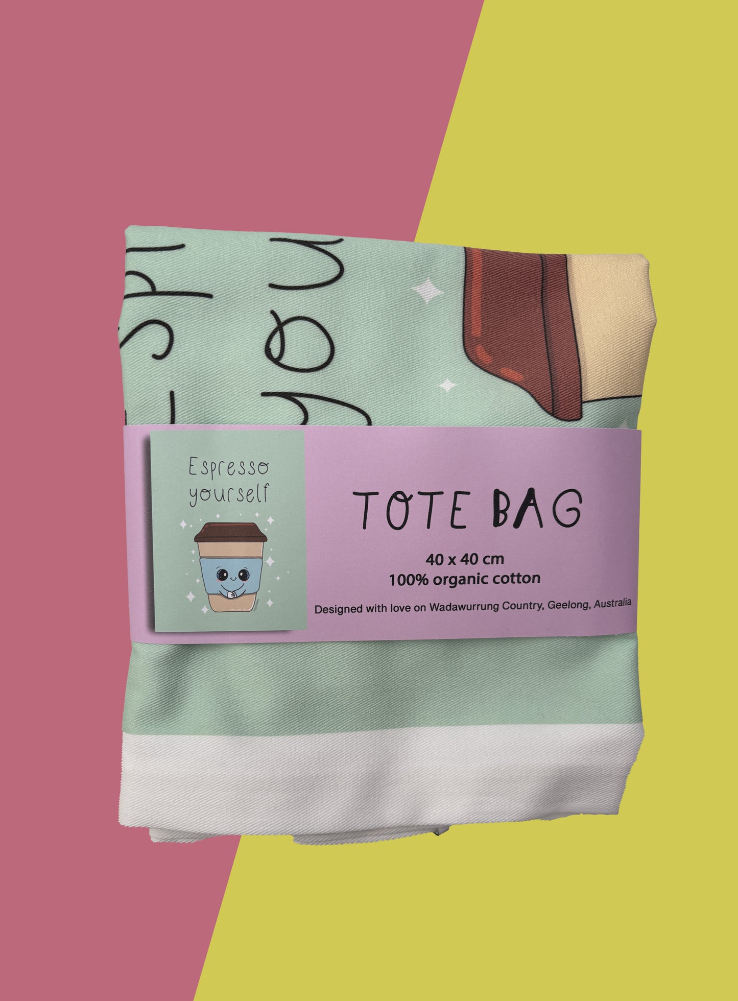 Folded coffee tote bag with purple belly band.