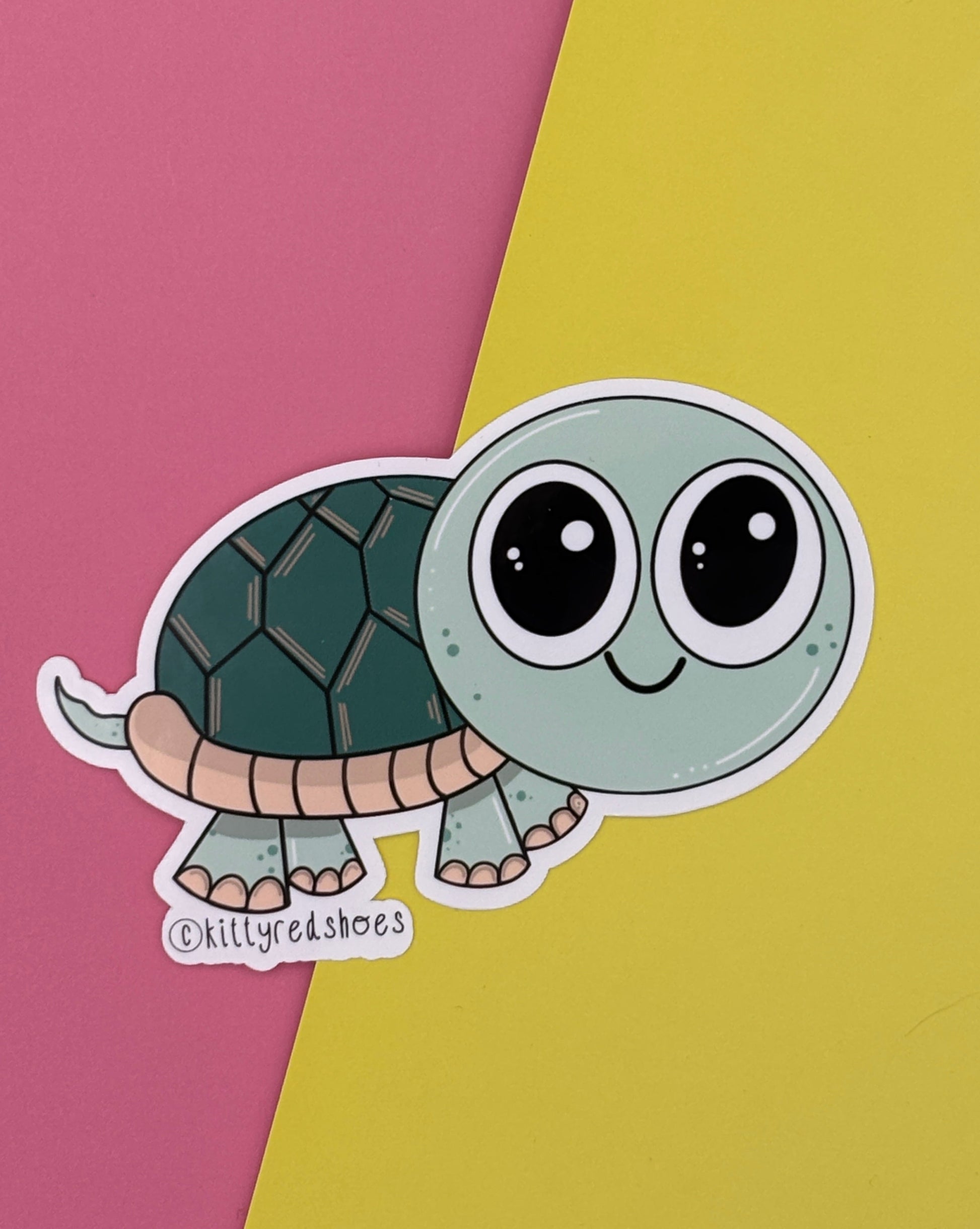 A cute green smiling turtle sticker with text copyright kittyredshoes